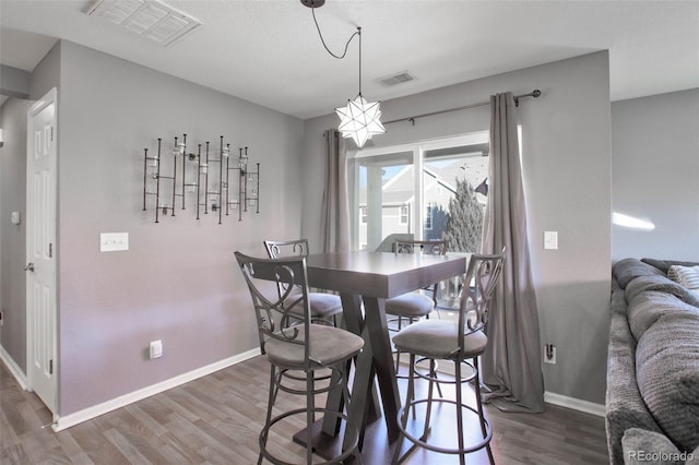 dining area featuring dark hardwood / wood-style floors