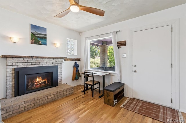 3154 N Columbine St, Denver, CO 80205 - entryway with wood finished floors, a fireplace, and a ceiling fan