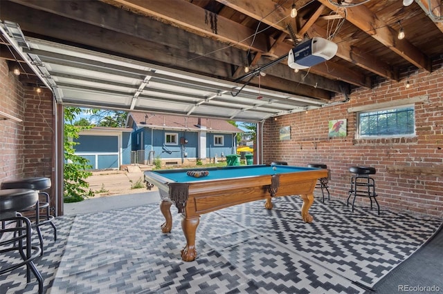 3154 N Columbine St, Denver, CO 80205 - playroom featuring brick wall, a garage, billiards table, and carpet