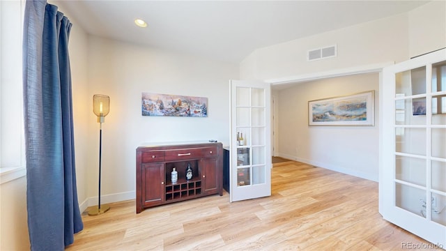 55 Morgan Cir, Erie, CO 80516 - hallway featuring french doors, light wood-style flooring, and recessed lighting