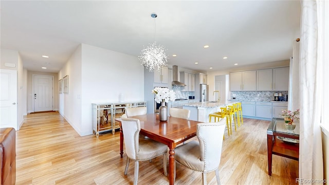 55 Morgan Cir, Erie, CO 80516 - dining room with light wood-style floors, recessed lighting, and a chandelier