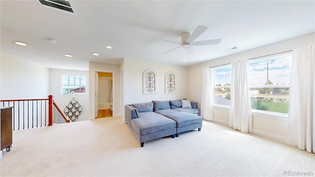 55 Morgan Cir, Erie, CO 80516 - carpeted living area featuring plenty of natural light, ceiling fan, and recessed lighting