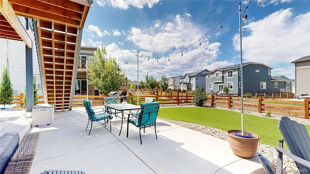 55 Morgan Cir, Erie, CO 80516 - view of patio / terrace featuring outdoor dining area and a residential view