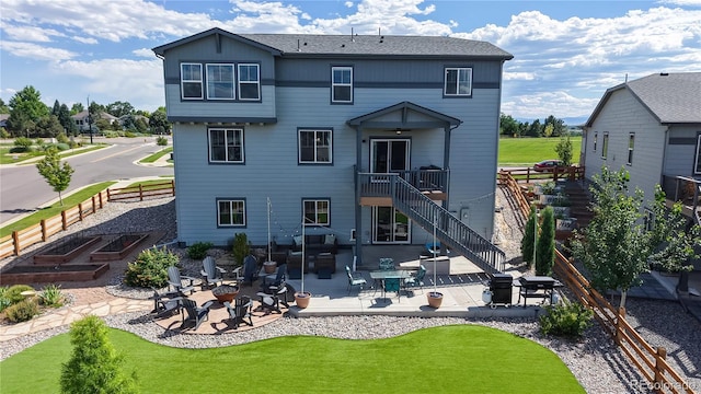 55 Morgan Cir, Erie, CO 80516 - rear view of property featuring a patio, stairway, and a fire pit