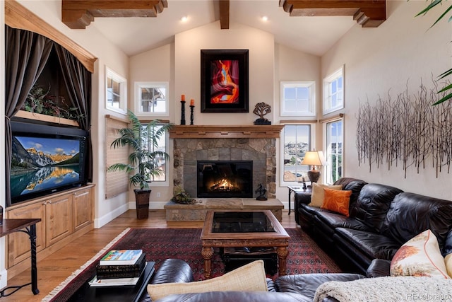 8002 Galileo Way, Littleton, CO 80125 - living room with high vaulted ceiling, a stone fireplace, wood finished floors, baseboards, and beam ceiling