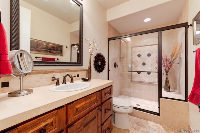 8002 Galileo Way, Littleton, CO 80125 - full bathroom featuring vanity, a shower stall, and toilet