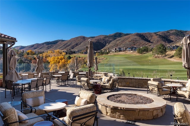 8002 Galileo Way, Littleton, CO 80125 - view of patio featuring golf course view, a fire pit, and a mountain view