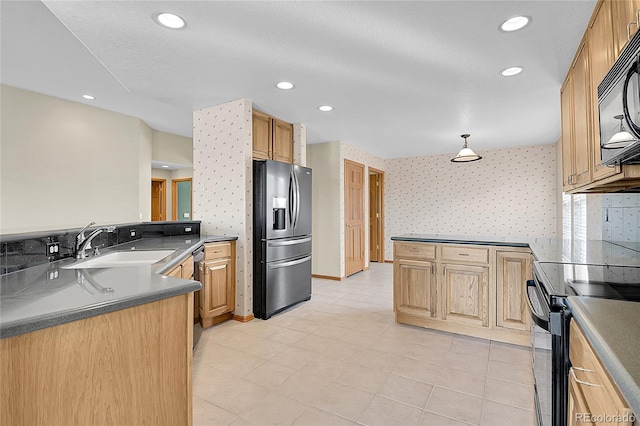 kitchen with a textured ceiling, sink, kitchen peninsula, stainless steel appliances, and light tile patterned flooring