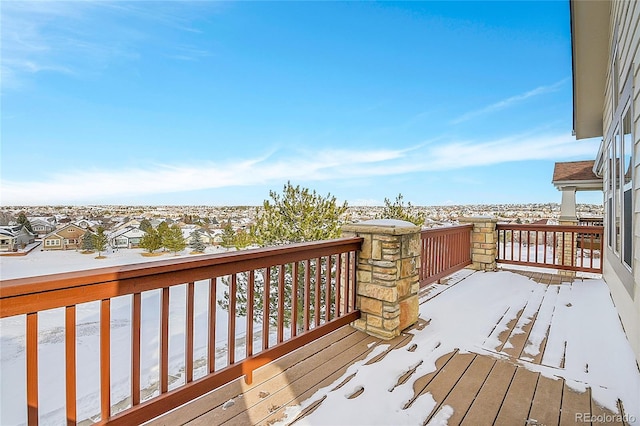 view of snow covered deck