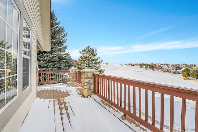 view of snow covered deck