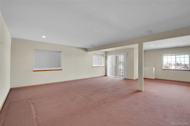 unfurnished room featuring light colored carpet