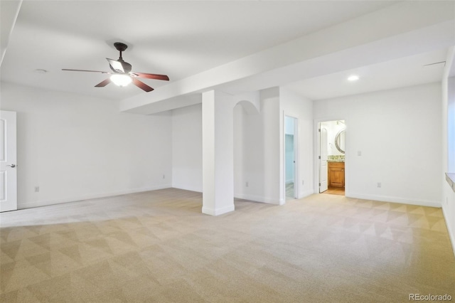 unfurnished living room featuring light colored carpet, a ceiling fan, baseboards, and recessed lighting