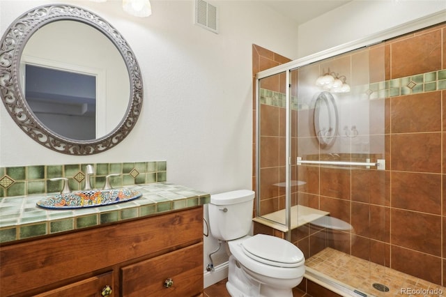 full bath featuring a shower stall, toilet, and vanity