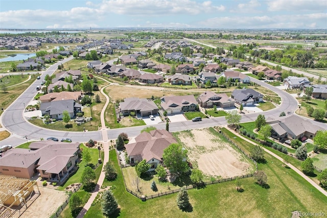 aerial view of property and surrounding area with nearby suburban area