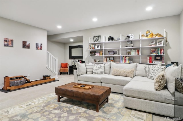 carpeted living room featuring stairs and recessed lighting