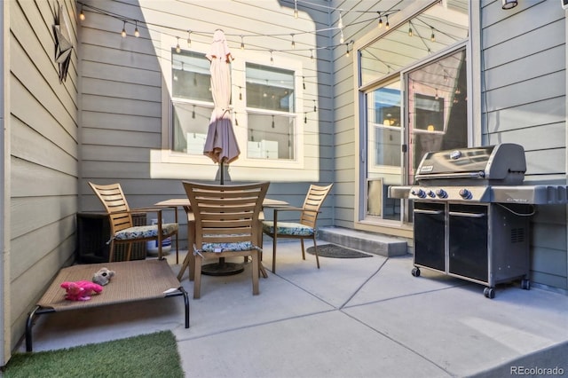 view of patio featuring outdoor dining area and grilling area