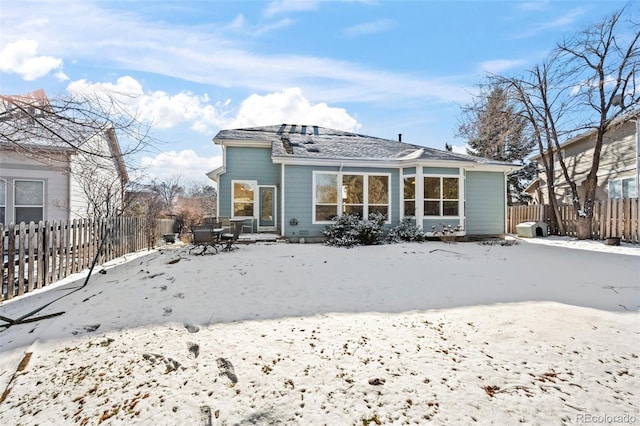 view of snow covered house