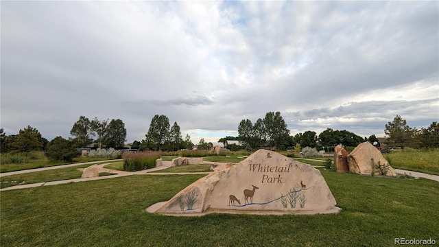 view of storm shelter with a yard