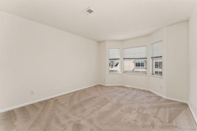 12573 E Pacific Cir Unit C, Aurora, CO 80014 - carpeted spare room featuring baseboards and a textured ceiling