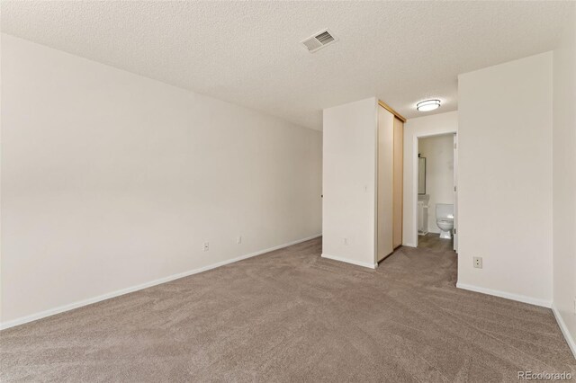 12573 E Pacific Cir Unit C, Aurora, CO 80014 - unfurnished room featuring carpet floors and a textured ceiling