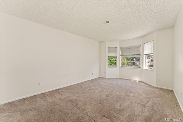 12573 E Pacific Cir Unit C, Aurora, CO 80014 - spare room featuring carpet floors and a textured ceiling