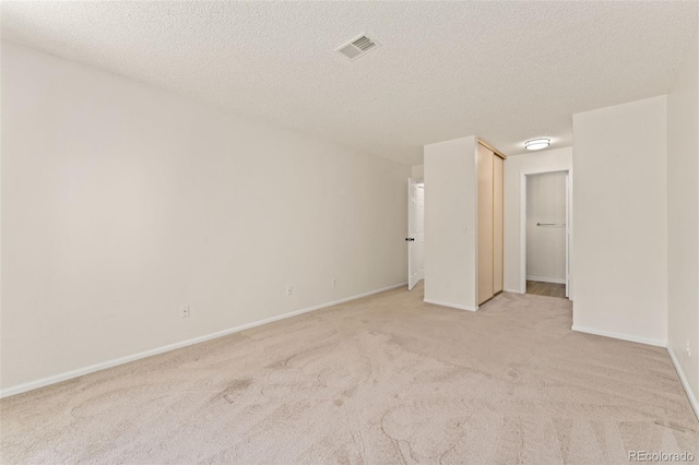 12573 E Pacific Cir Unit C, Aurora, CO 80014 - unfurnished room with light carpet and a textured ceiling