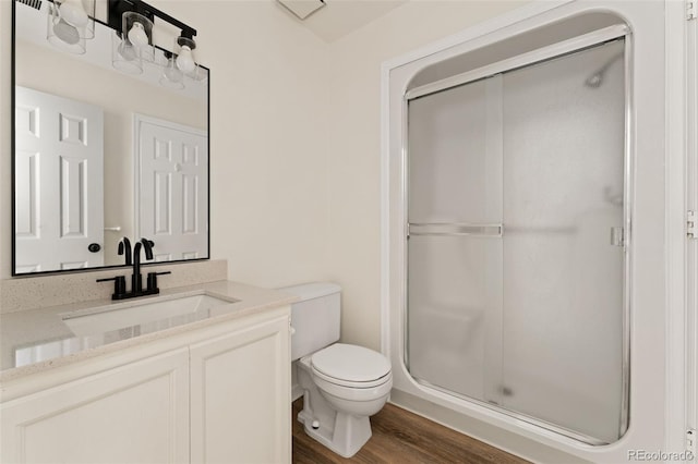 12573 E Pacific Cir Unit C, Aurora, CO 80014 - full bath featuring a stall shower, vanity, and wood finished floors