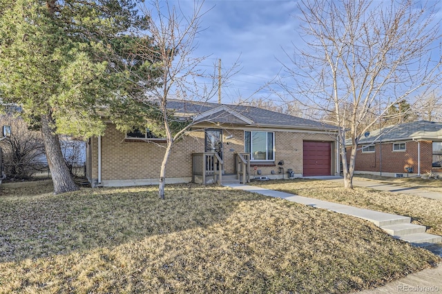 ranch-style house with concrete driveway, an attached garage, and brick siding