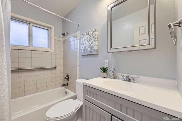 bathroom with vanity, toilet, and shower / tub combo