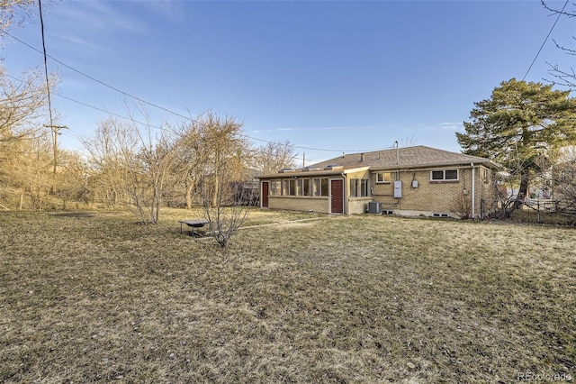 exterior space with fence, central AC, and a sunroom