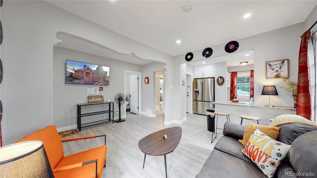 living room with light hardwood / wood-style flooring