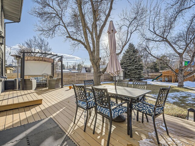 wooden deck with a pergola, outdoor lounge area, and a playground