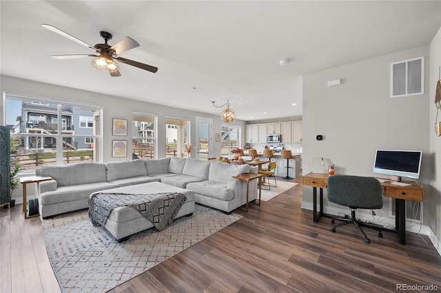 199 Simmental Loop, Castle Rock, CO 80104 - living area featuring plenty of natural light, wood finished floors, a ceiling fan, and recessed lighting