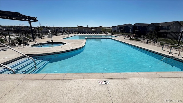 199 Simmental Loop, Castle Rock, CO 80104 - community pool with a hot tub, a patio, and a residential view