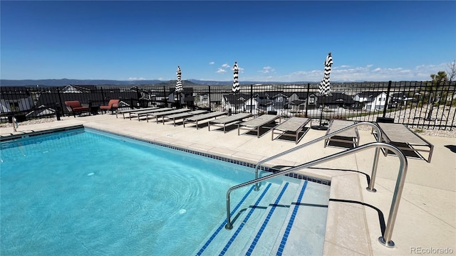 199 Simmental Loop, Castle Rock, CO 80104 - community pool featuring a patio area and a mountain view
