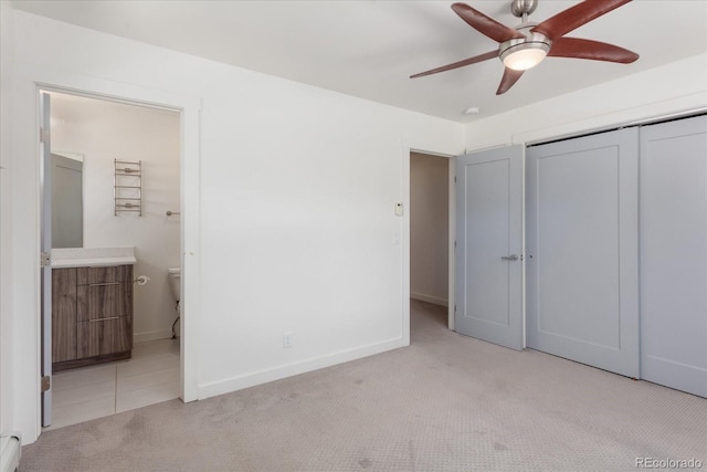 334 Old Stage Rd Unit B, Salida, CO 81201 - unfurnished bedroom featuring carpet floors, a closet, ensuite bath, baseboard heating, and ceiling fan
