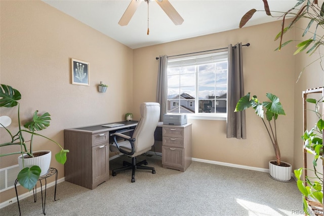 office with light carpet, a ceiling fan, and baseboards