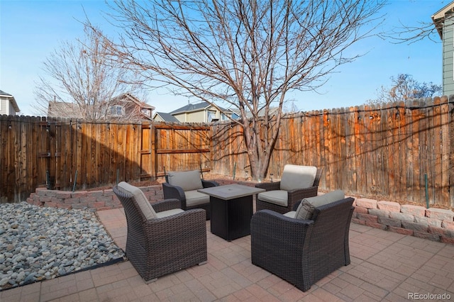 view of patio with a fenced backyard and outdoor lounge area