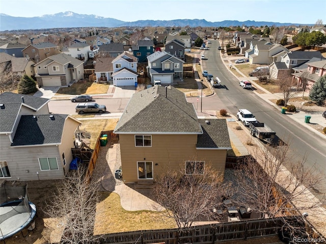 drone / aerial view featuring a mountain view and a residential view