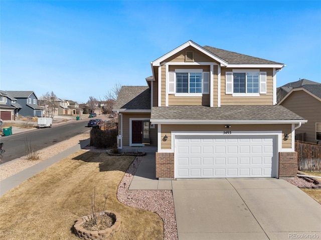 view of front of property with fence, a residential view, concrete driveway, a garage, and brick siding