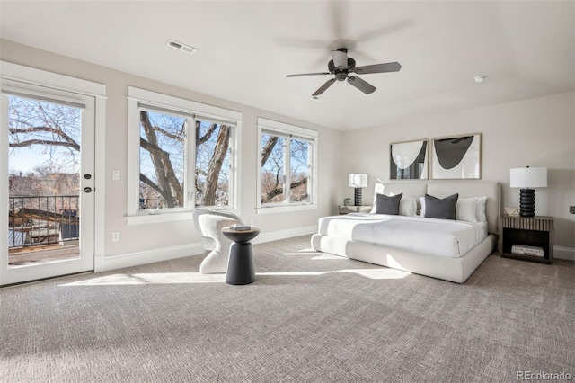 bedroom featuring access to outside, light colored carpet, and ceiling fan