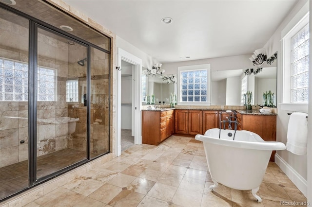 bathroom with independent shower and bath and vanity