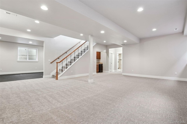 unfurnished living room featuring dark carpet