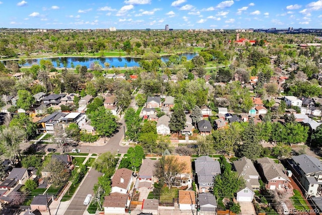 aerial view of property's location with a nearby body of water and nearby suburban area