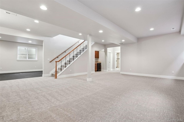below grade area with recessed lighting, stairway, baseboards, and carpet