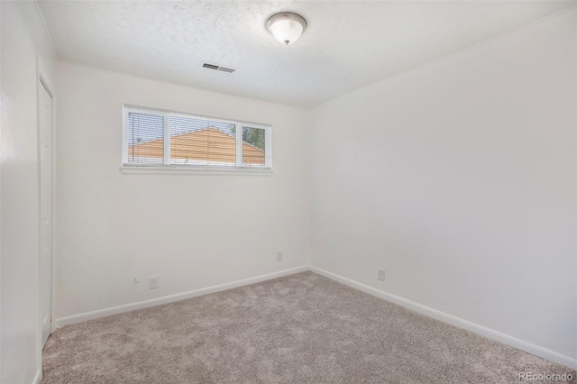 1303 Havana St, Aurora, CO 80010 - empty room featuring carpet floors and a textured ceiling
