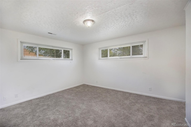1303 Havana St, Aurora, CO 80010 - carpeted empty room with a textured ceiling and baseboards