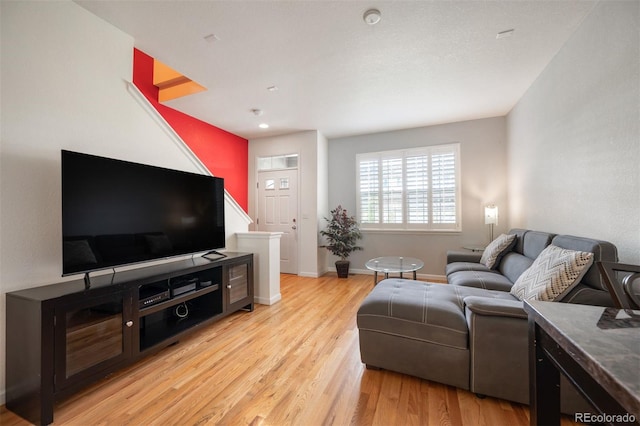 767 Roslyn St Unit 20, Denver, CO 80230 - living area with baseboards and light wood finished floors