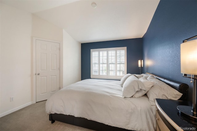 767 Roslyn St Unit 20, Denver, CO 80230 - bedroom featuring carpet floors, baseboards, and lofted ceiling