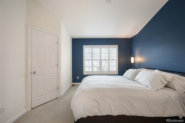 767 Roslyn St Unit 20, Denver, CO 80230 - bedroom featuring baseboards and light carpet